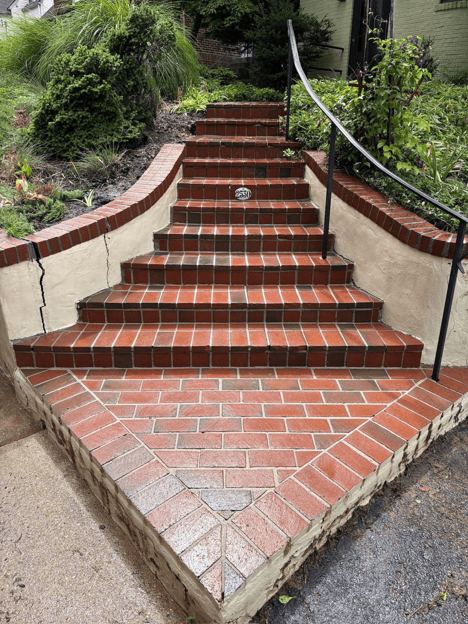 Brick staircase after soft washing — clean, bright red brick