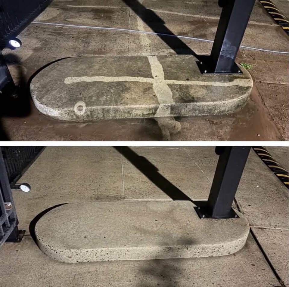 commercial power washing, heavy grime removed from a bollard base and parking pad, Maryland