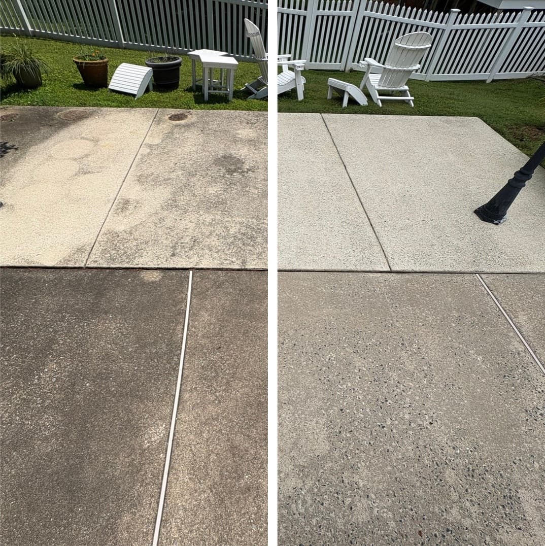 power washing a concrete patio in a fenced backyard, black mold stains removed from the slab, Maryland
