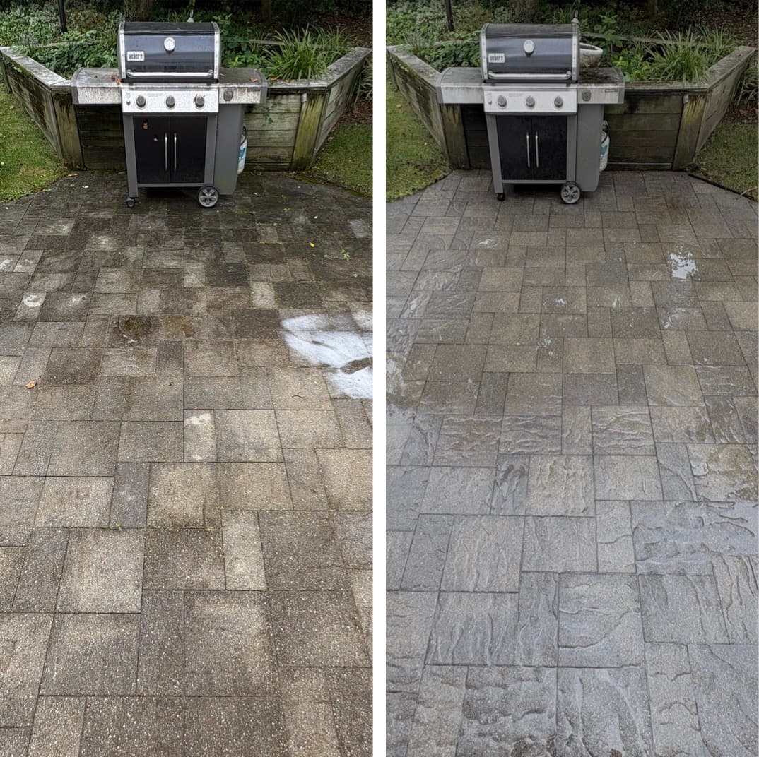 power washing a paver patio around a grill station, green algae film washed off the stone, Maryland