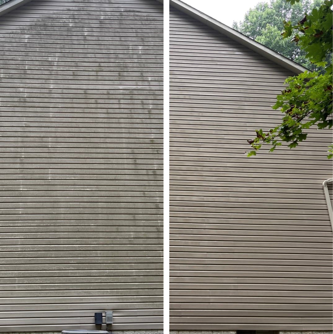 pressure washing a tall gable end wall, vertical green algae streaks removed from the siding, Maryland
