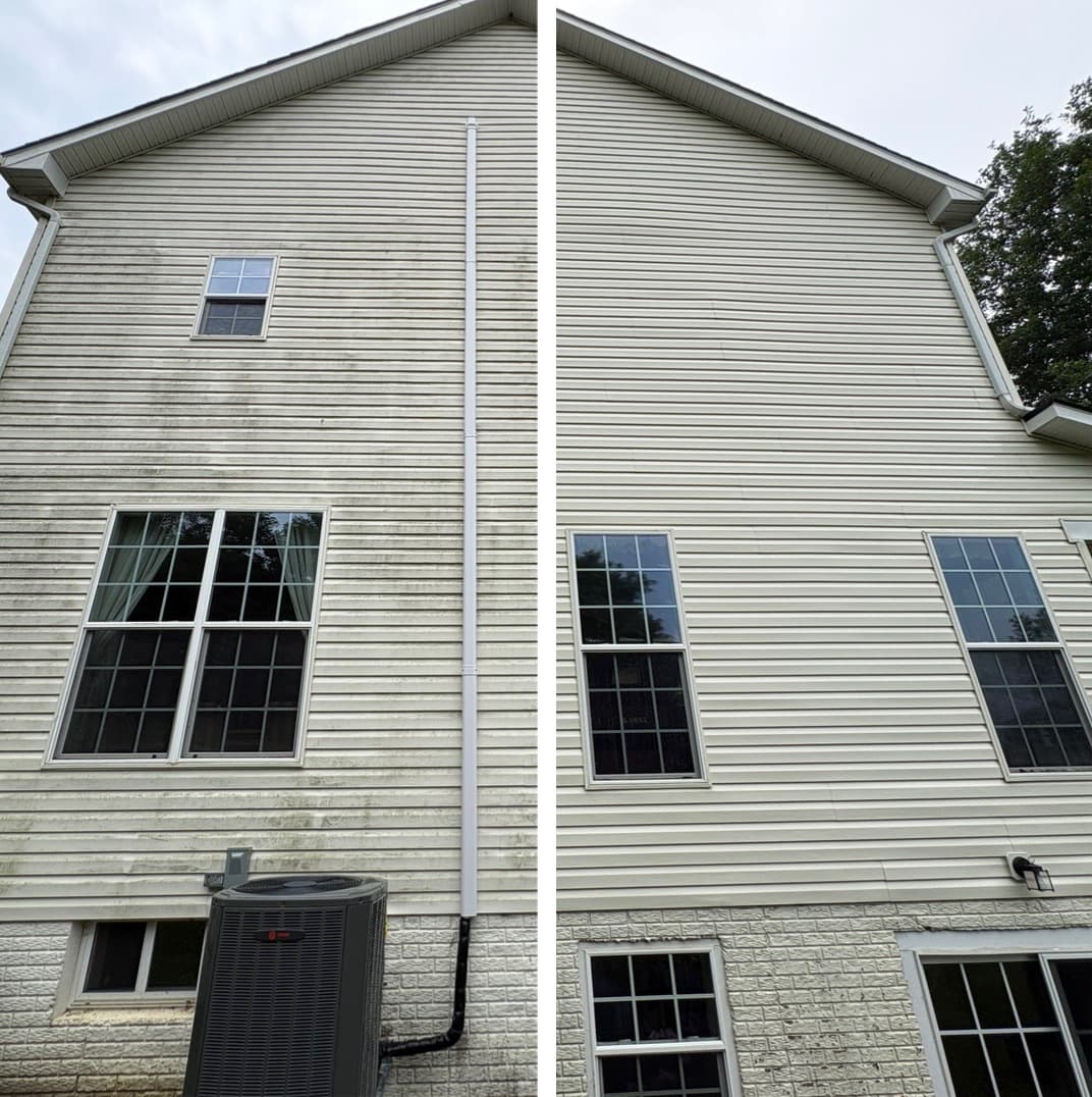 two-story house washing, algae streaks removed from vinyl siding above a block foundation, Maryland