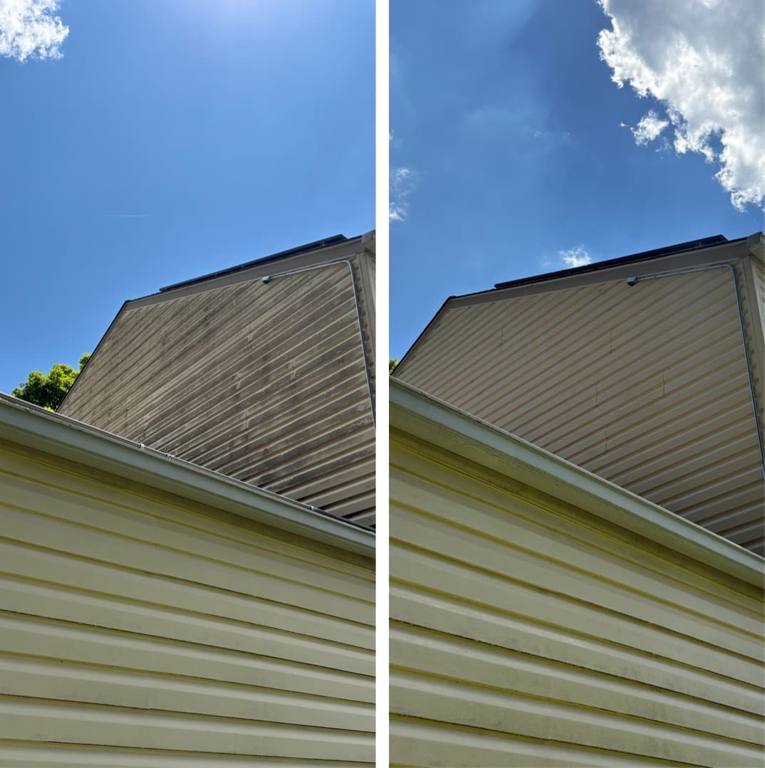 soft washing a hard-to-reach upper gable, dark mildew streaks removed above the second story, Maryland