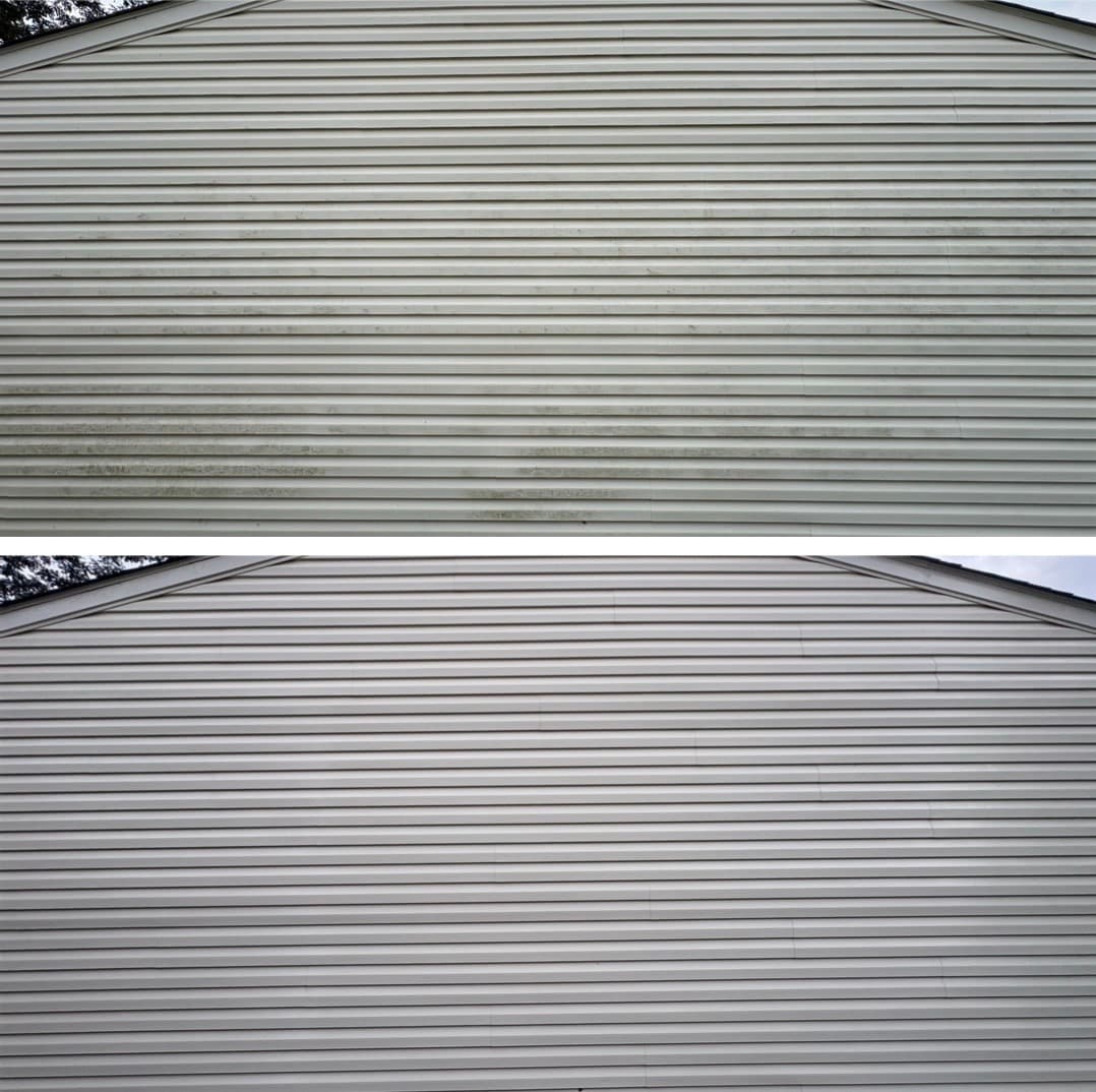 vinyl siding cleaning on a wide gable, green algae banding removed from the lower courses, Maryland